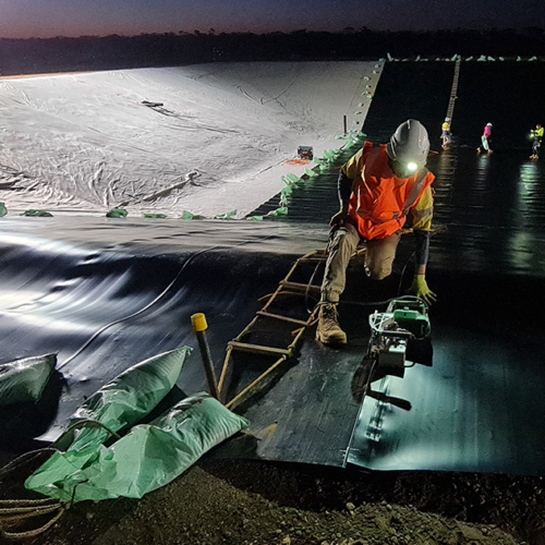Installation of a liner in a covered anaerobic lagoon.